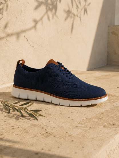 The Capri in Navy — mesh-knit sneaker-oxford, cognac heel loop