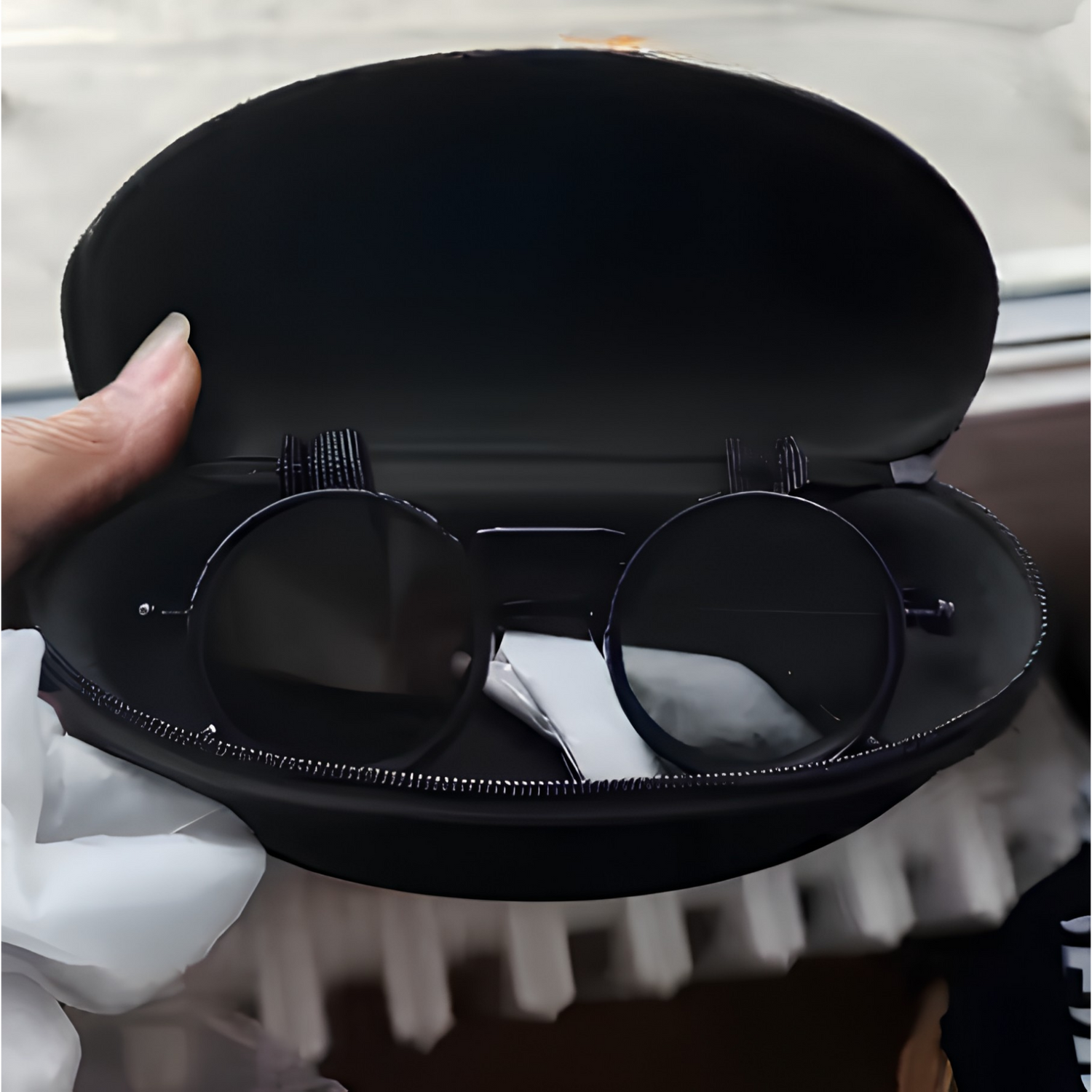 DayShift adaptive sunglasses inside the included premium hard case with microfibre cleaning cloth