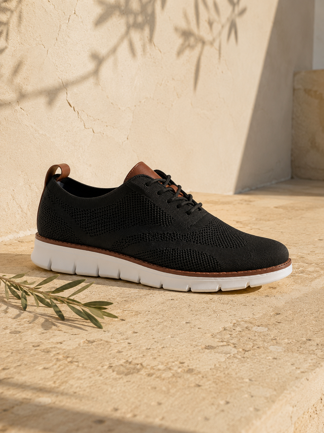 The Capri in Black — mesh-knit sneaker-oxford, cognac heel loop