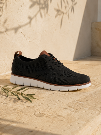 The Capri in Black — mesh-knit sneaker-oxford, cognac heel loop
